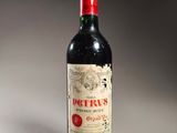 a bottle of wine that is sitting on a table