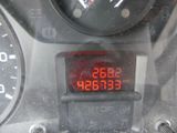 a digital clock on the dashboard of a motorcycle