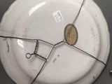 a white plate with a hole in the middle of it