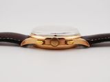 an image of a close up of a watch on a white surface