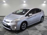 a picture of a silver toyota prius parked on a checkered floor