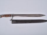 a knife and a knife holder on a table