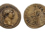 a gold coin with an image of a woman and a man on it