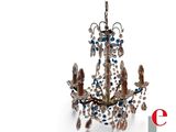 an image of a chandelier with blue and white crystals hanging from it