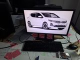 a computer monitor with a picture of a car on it