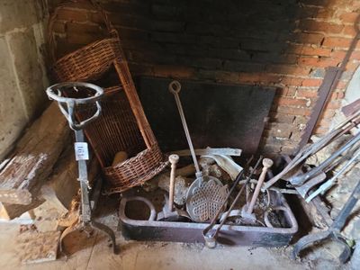 a pile of tools sitting in front of a fire place