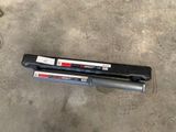 a couple of tools laying on the floor next to each other