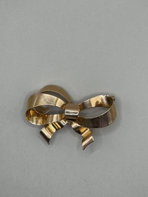 Broche en or jaune 750 millièmes en forme de noeud de ruban … - Photo 1