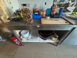 a kitchen counter with a bunch of cooking utensils on it