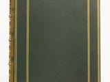 an old green book with gold trim and a gold border