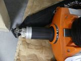 a corded nailer with a cord attached to it