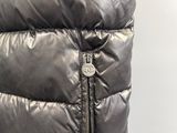 the jacket is shiny and shiny with a zipper down the side