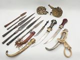 many different types of knives and other items on the table
