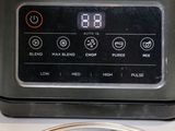 an image of a close up of a food processor on a counter