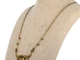 a close up of a necklace on a mannequin mannequin