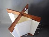 a wooden cross that is on top of a book