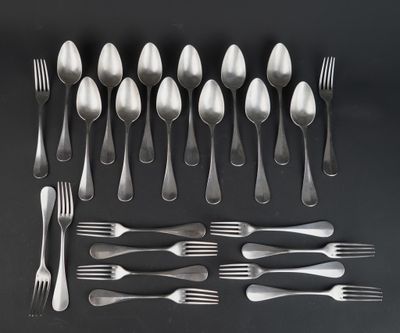 a lot of silver spoons and forks on the table