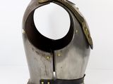 a silver helmet with a gold chain on it