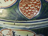 a close up of a vase with a bird design on it
