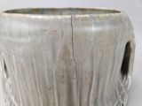 a close up of a vase with a crack in it