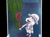 a glass plate with a picture of a child holding a watermelon