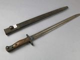 two knives are sitting on a white surface next to each other