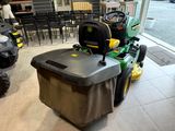 a lawn mower sitting in the middle of a room