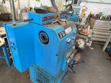a blue machine that is sitting in a garage
