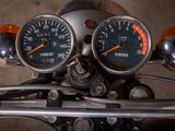 two gauges on the handlebars of a motorcycle