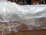 a large box with plastic wrap on top of it in a warehouse