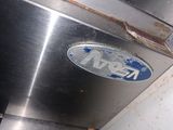 an image of a close up of the emblem on a stainless steel oven