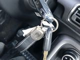 a car dashboard with a bunch of keys in it