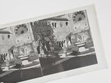 a black and white photo of a building with a fountain