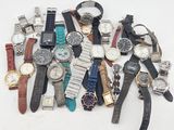 a lot of watches that are sitting on a table