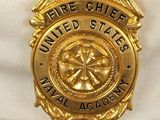 a badge on the hat of a fire chief