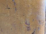 a close up of a piece of metal with rust on it