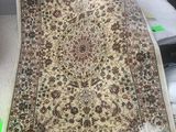 a large rug on a table in a room