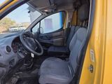 a small yellow truck with a steering wheel and a dashboard