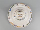 a white plate with a blue and yellow design on it
