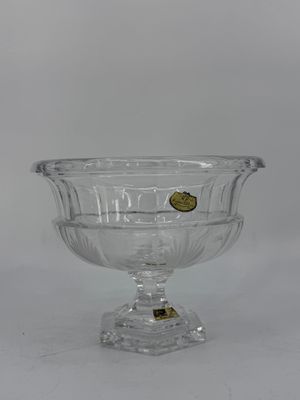 bol en verre transparent avec un bouton doré au fond
