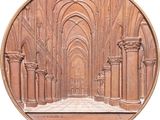 an image of a bronze medal depicting the interior of a cathedral
