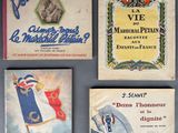 four books on a table with french and french flags on them