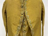 an image of a yellow jacket on a mannequin