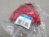 a plastic bag that has a red hat in it