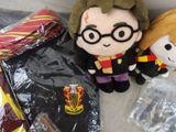 harry potter and hermione plush toy sitting next to each other on a couch