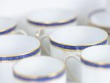 a lot of cups that are sitting on a table