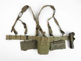 an image of a pair of holsters hanging on a wall
