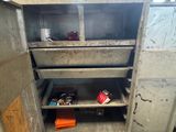 a metal cabinet that has a bunch of items in it