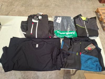 a lot of clothing that is sitting on a table