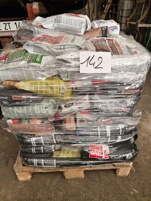 a pile of newspapers on a pallet in a warehouse